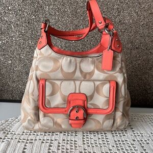 Coach Campbell Signature hobo bag with peachy coral leather trim front buckle